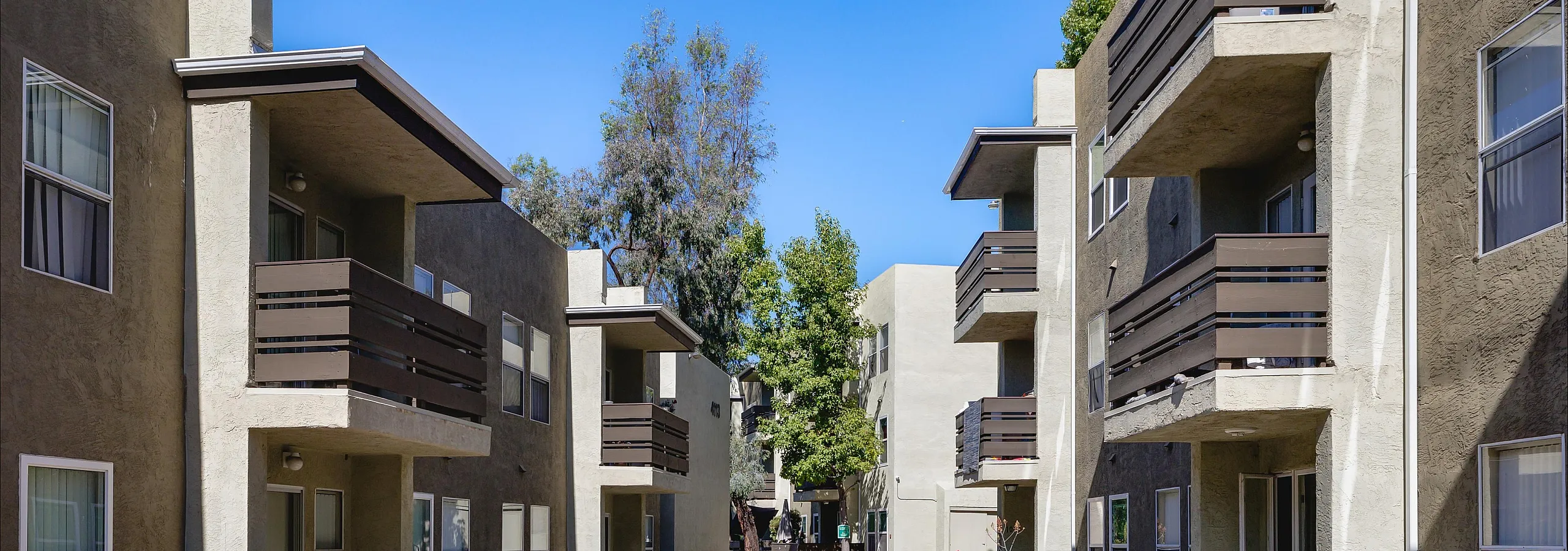 apartment complex with trees