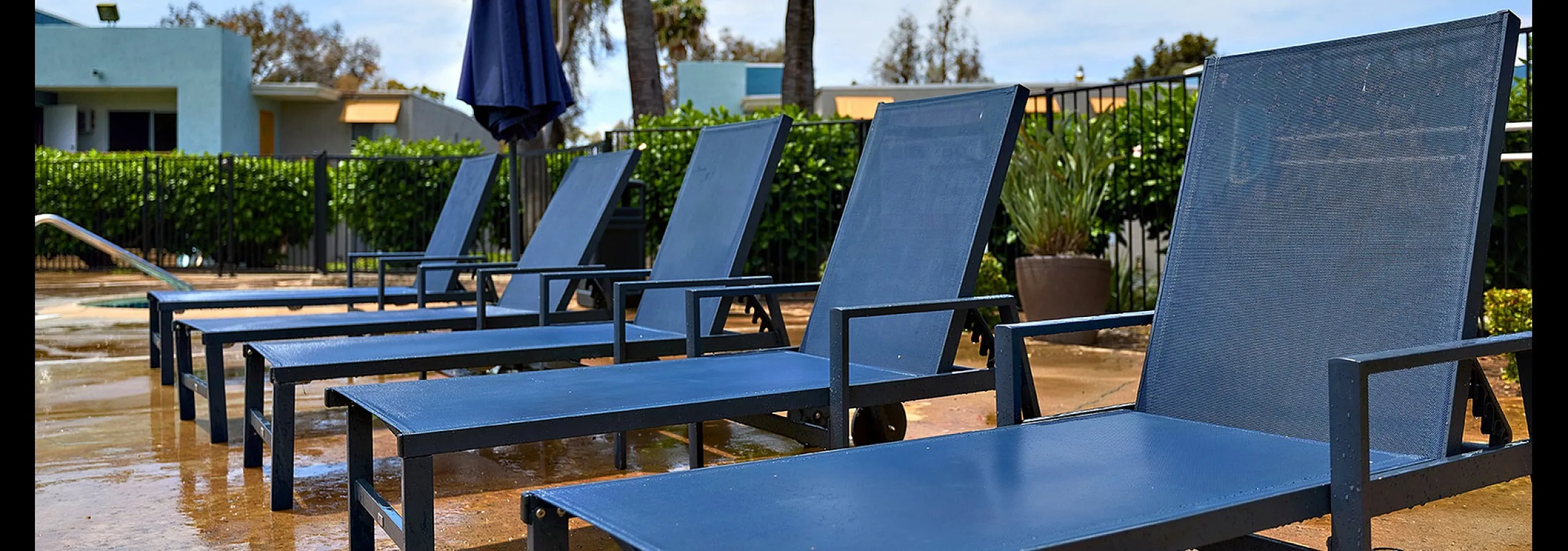 Community pool and lounge chairs