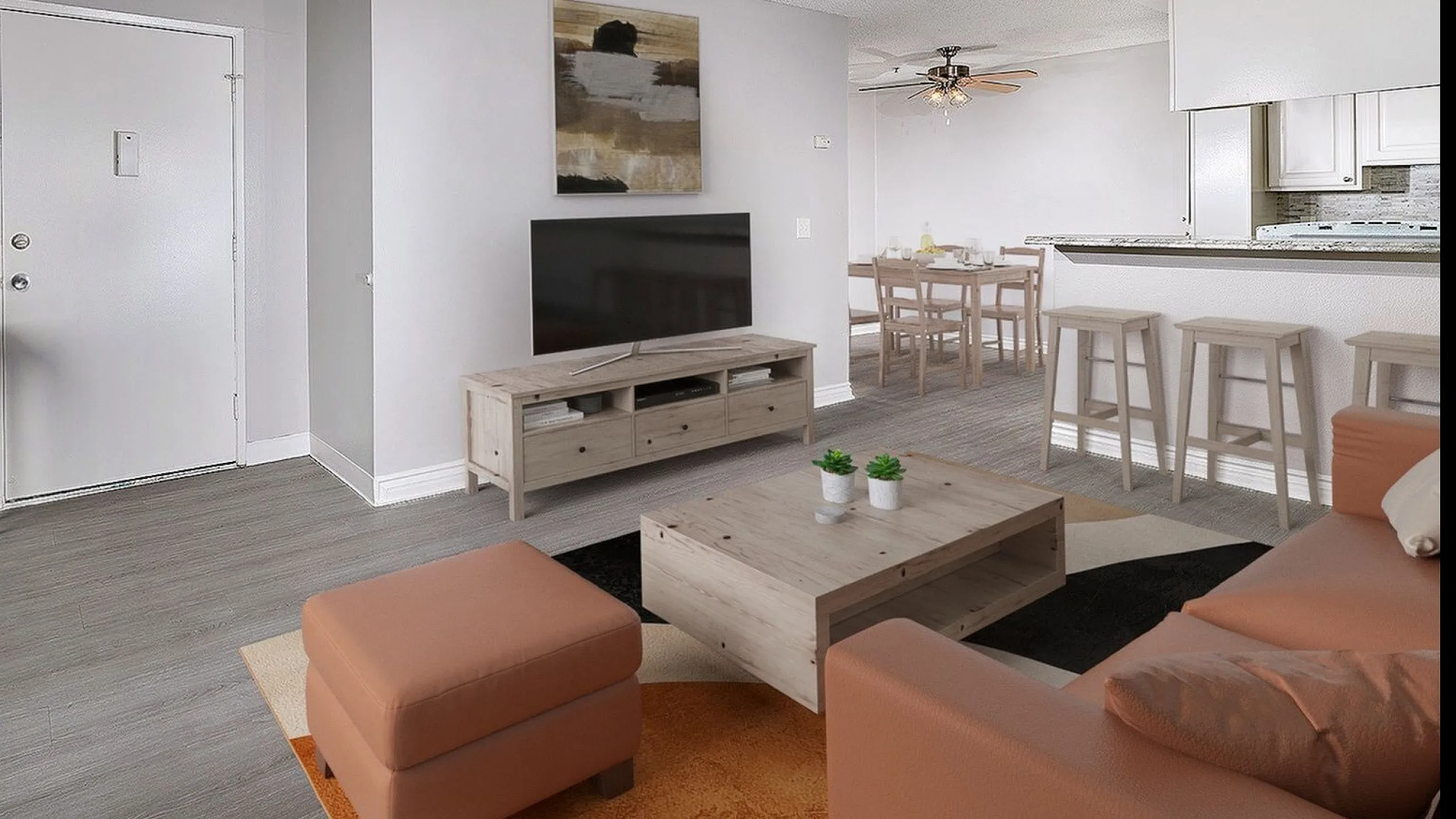 virtually staged apartment living room, kitchen and dining area