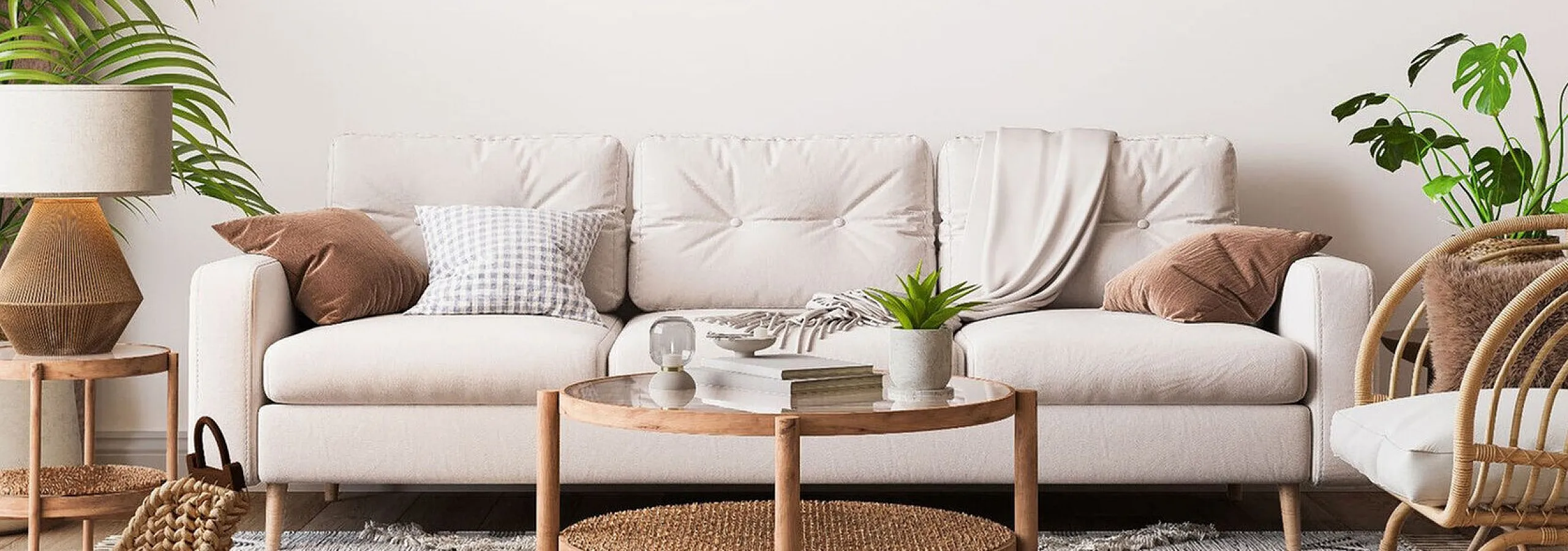 white sofa with accent pillows and round coffee table