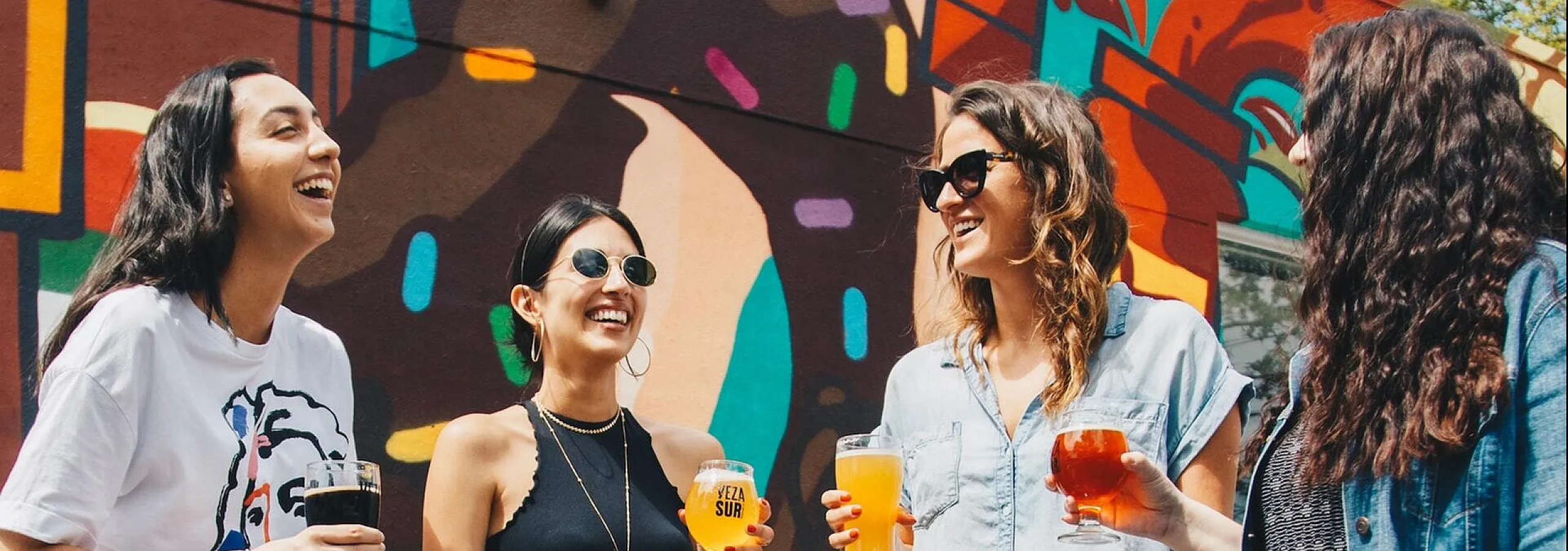 women having drinks outside