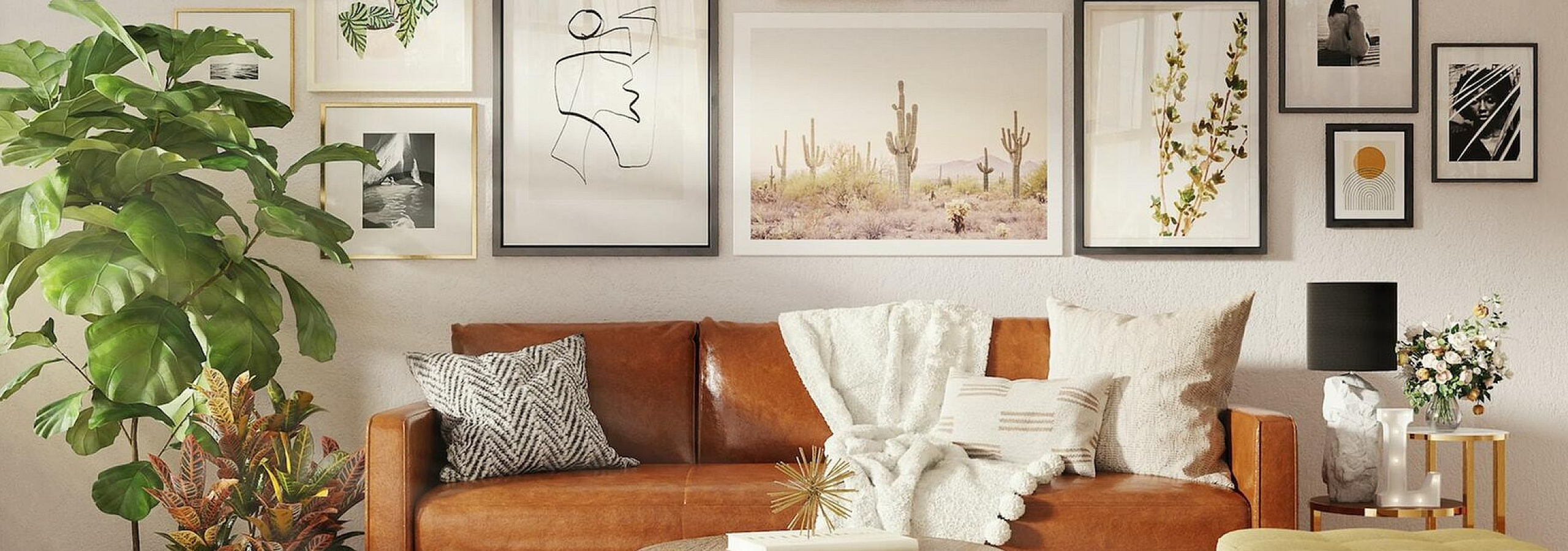 brown leather sofa with many art frames hanging behind