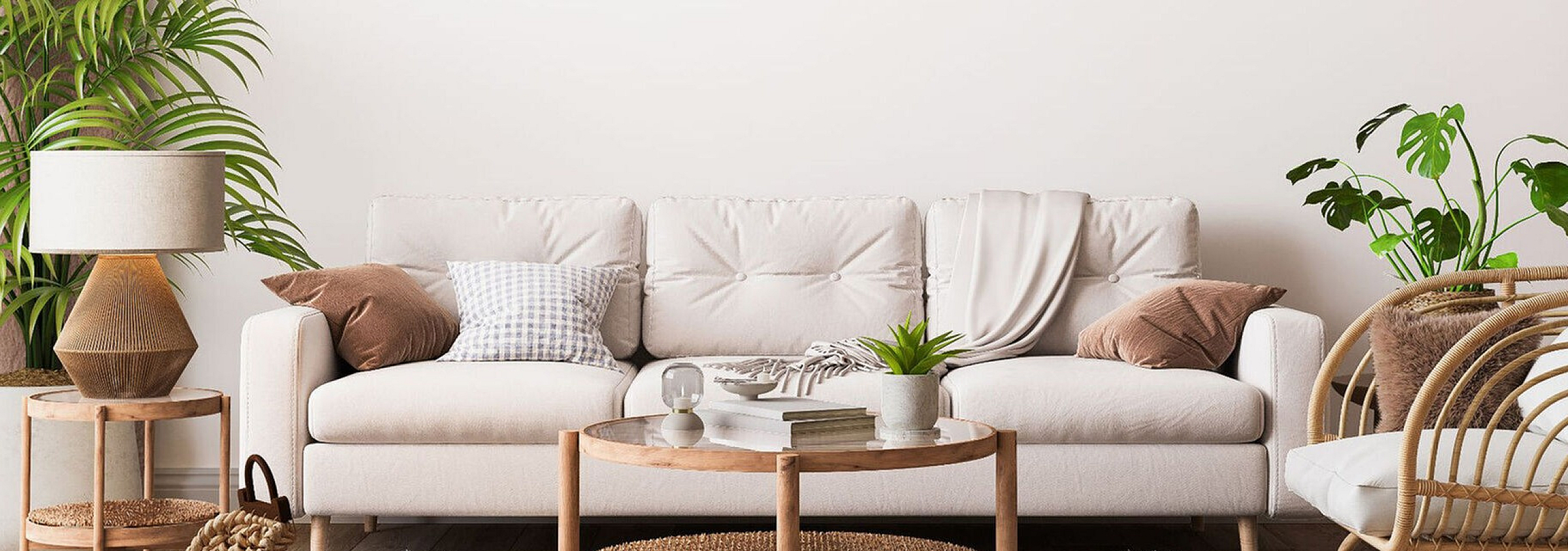 white sofa with accent pillows and round coffee table