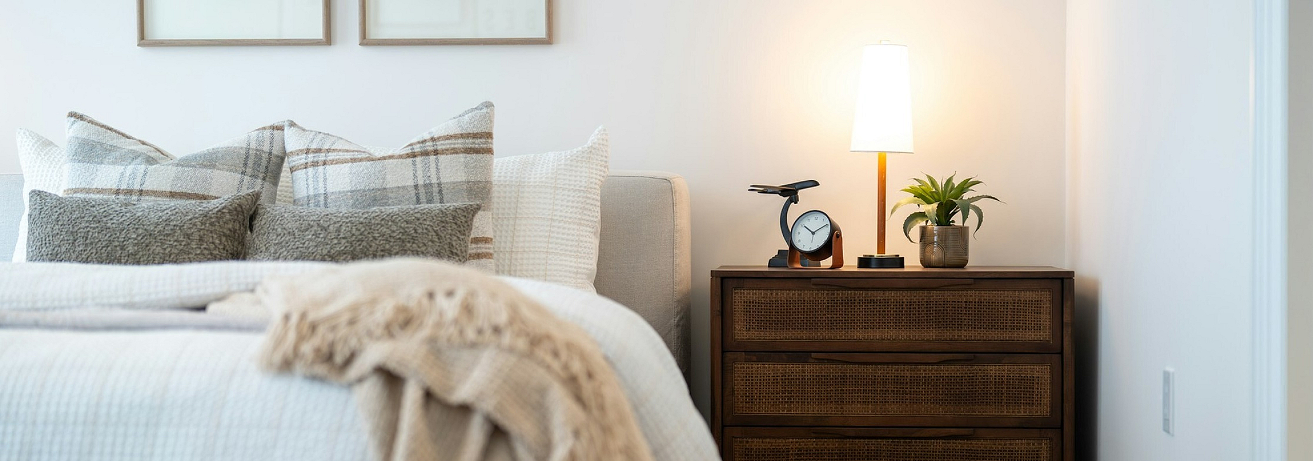 bed with accent pillows and side table