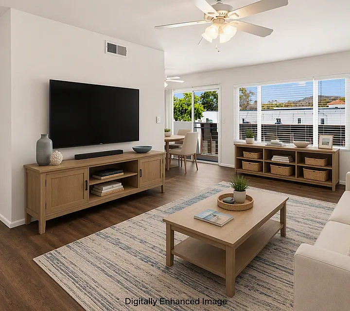 virtually staged living room with chairs and couch and glass coffee table