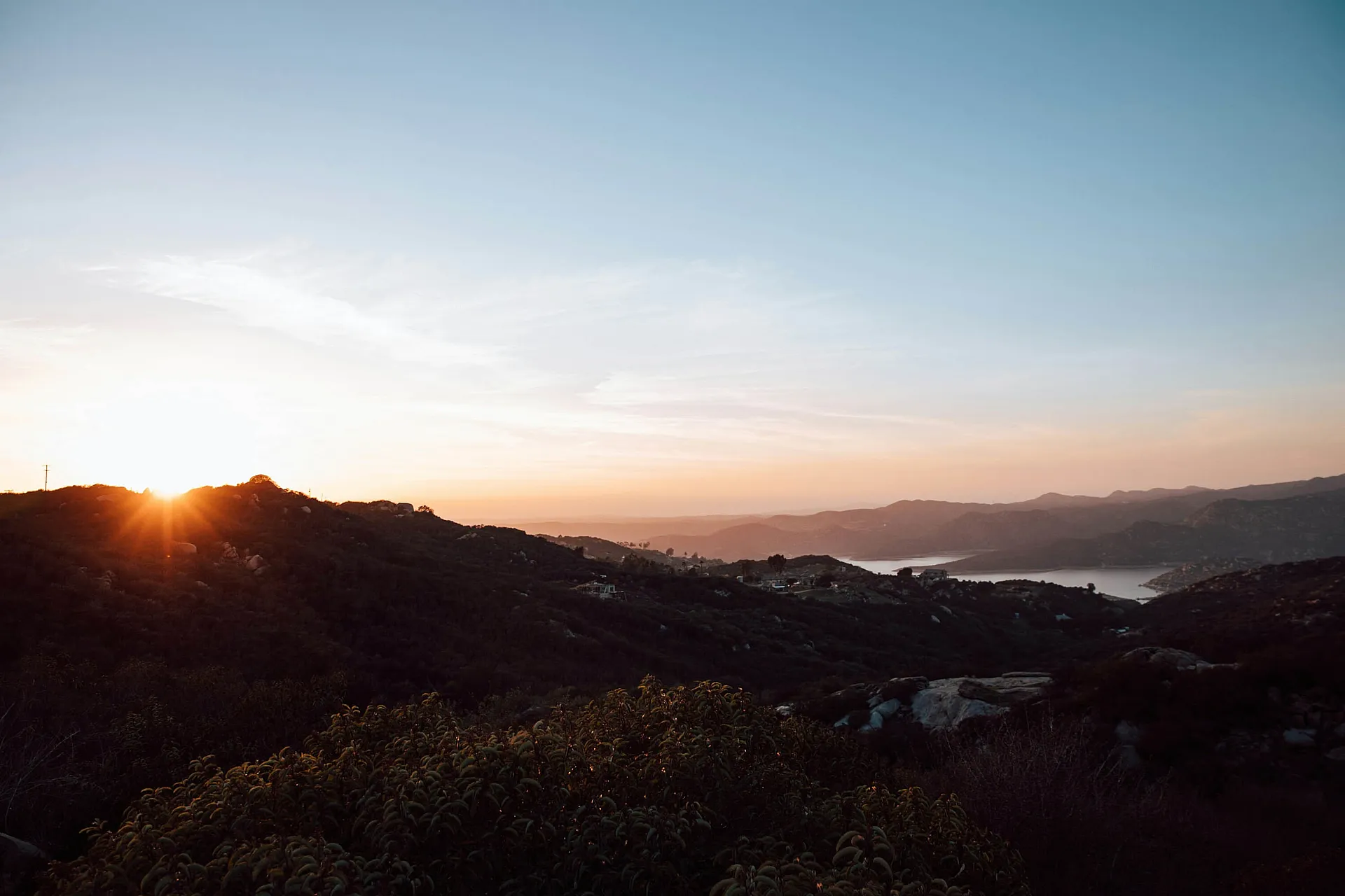 A gorgeous sunset over local San Diego hills and water, highlighting your connection to nearby outdoor spaces.