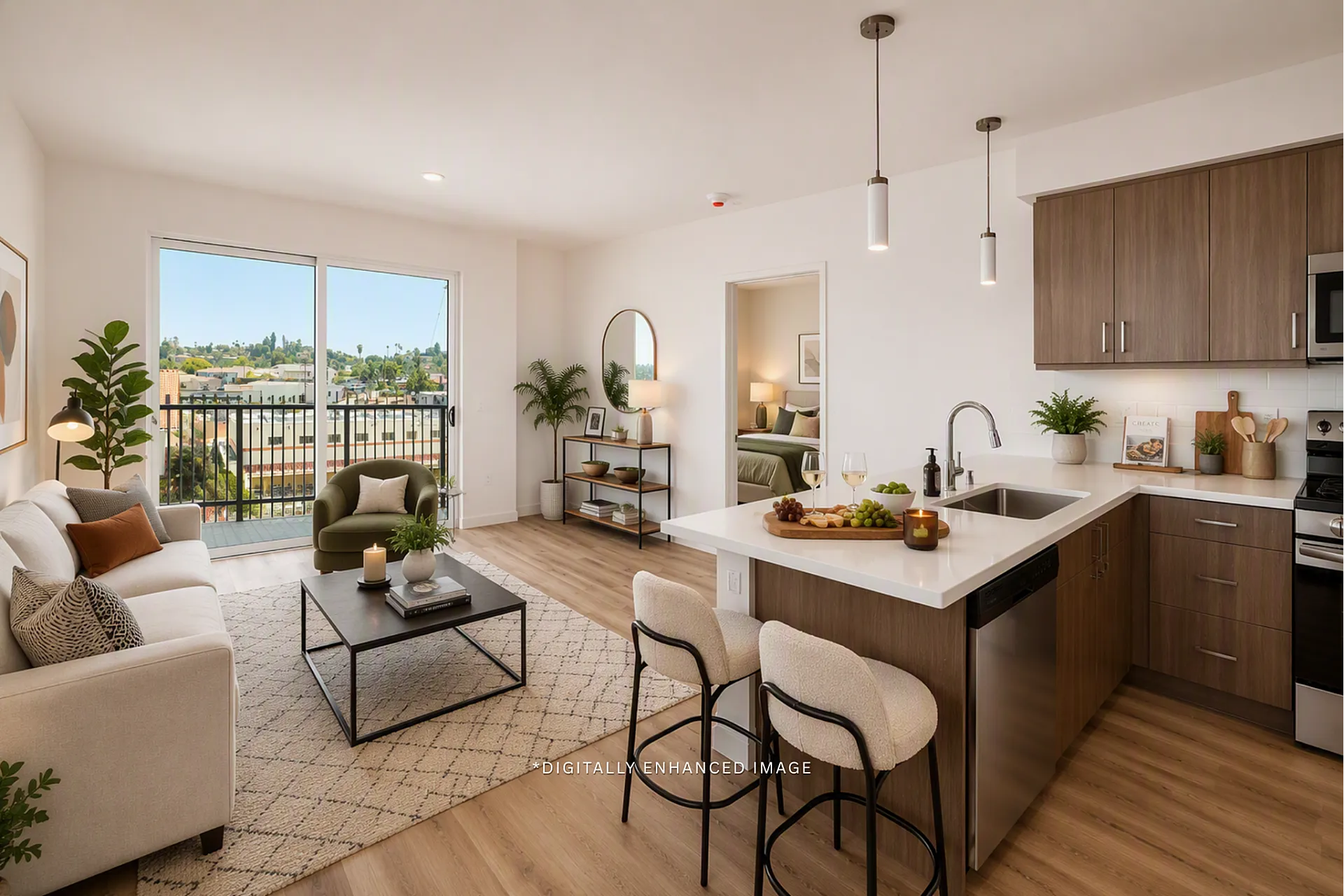Bright open floor plan at textur featuring a modern kitchen with a breakfast bar and a sliding door to the balcony.