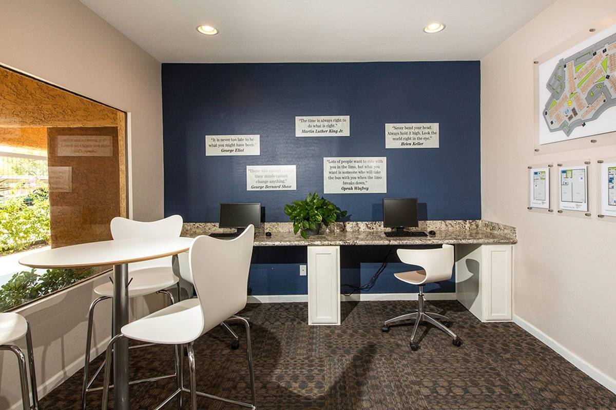 community business center with 2 computers and blue accent wall at at Metro on Main