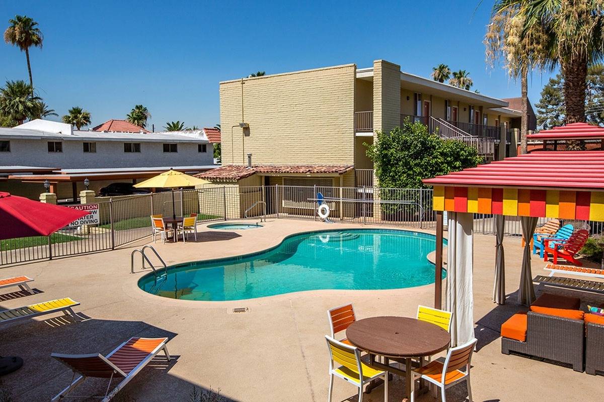 pool with colorful chairs and lounge chairs at Solaris at The Biltmore