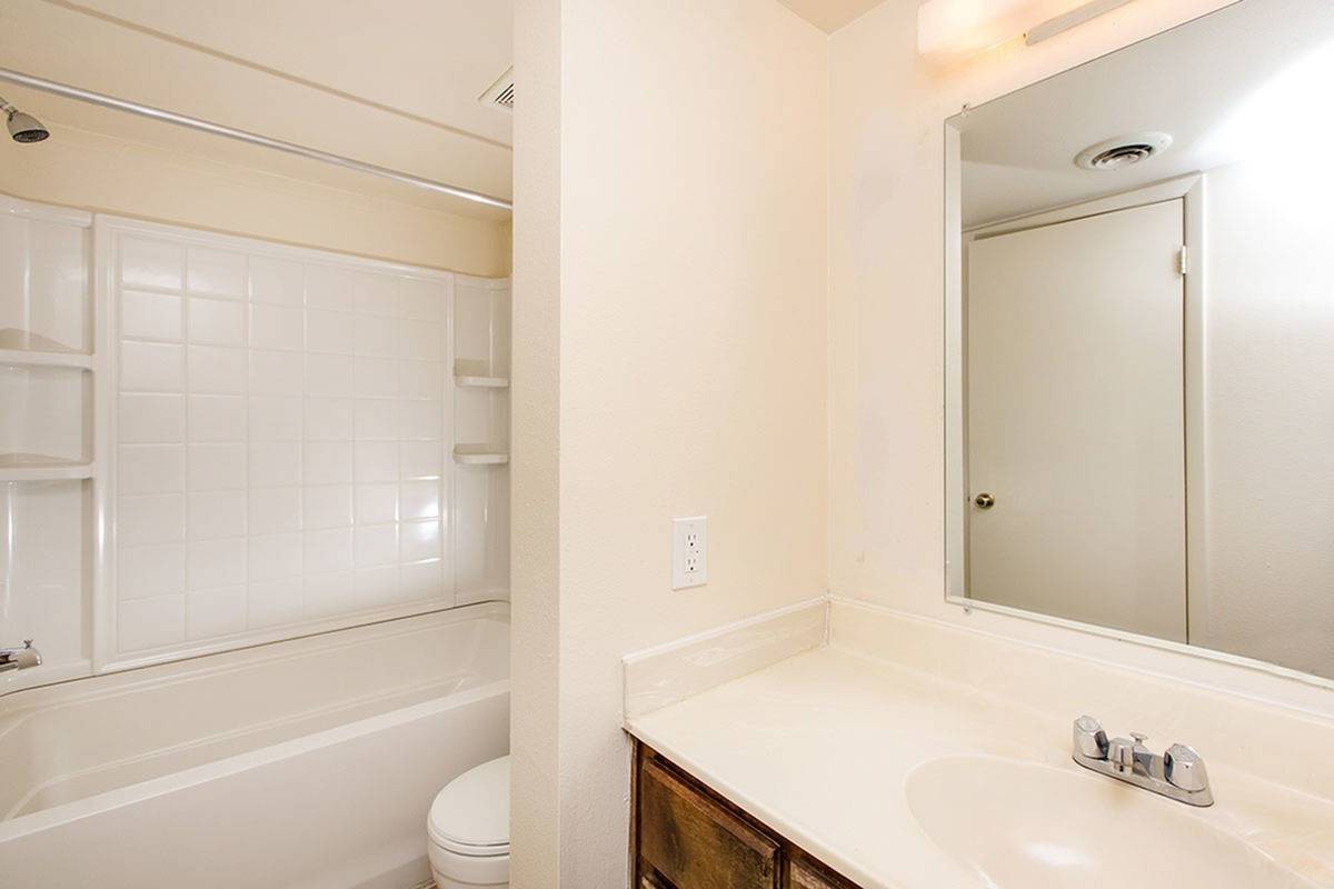 full bath with shower tub combo and white vanity at Bridge Lane