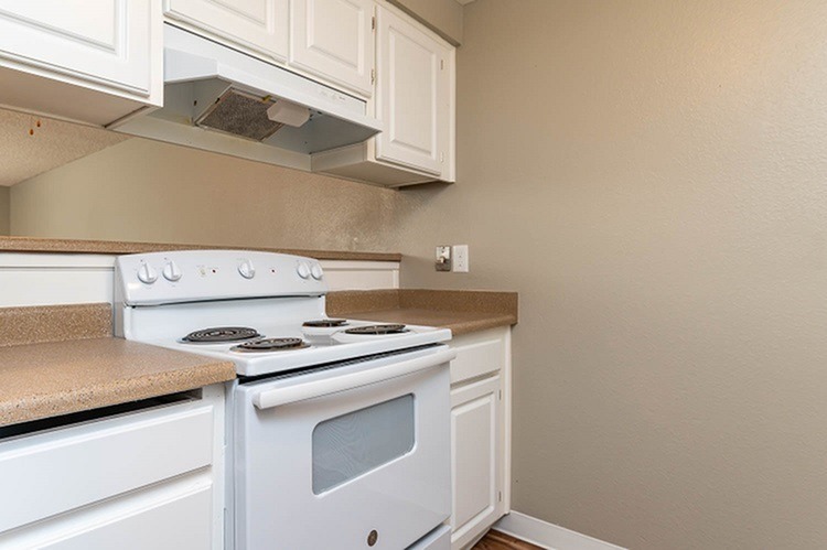 Kitchen with White Appliances and Cabinets