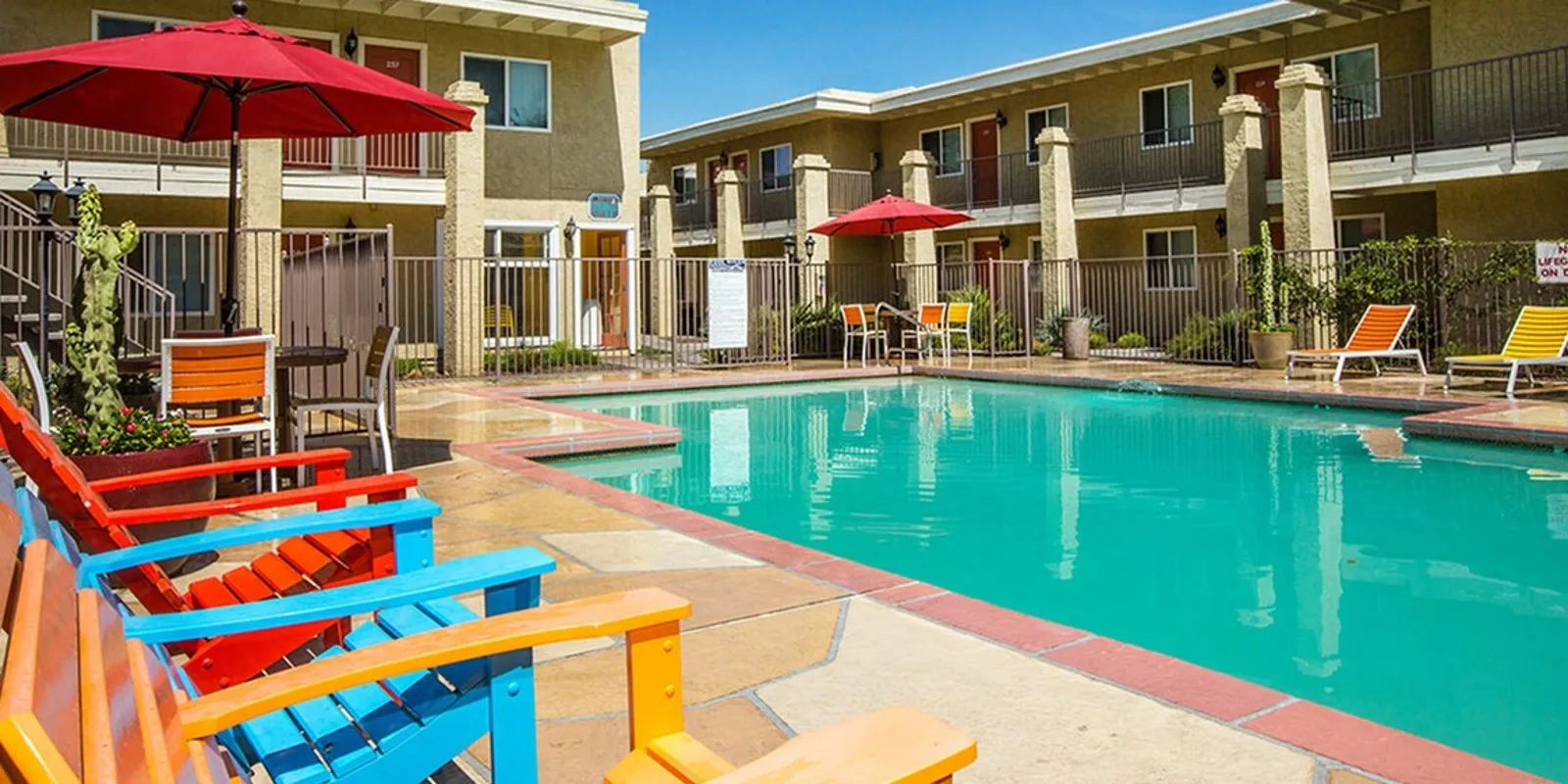 pool with colorful lounge chairs at solaris at the biltmore