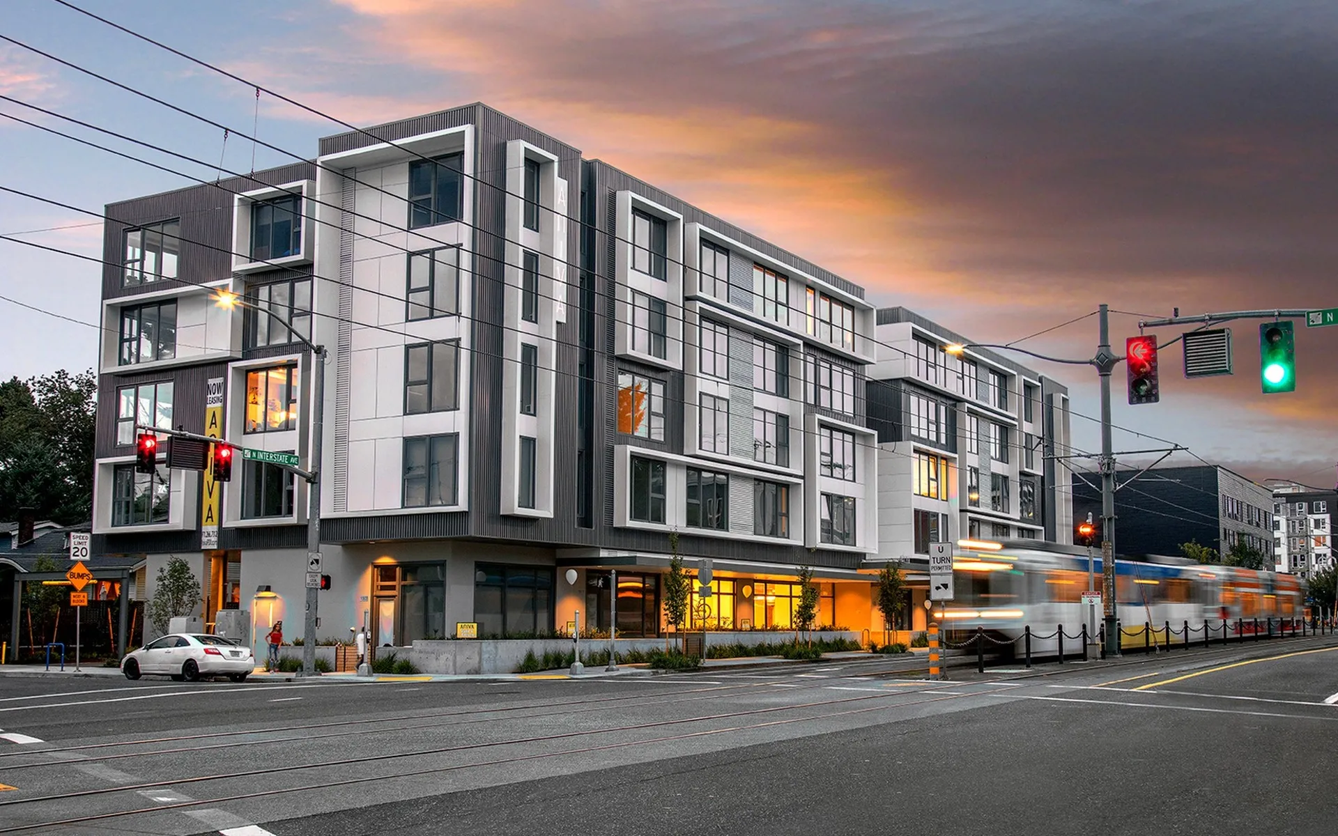 kitty-corner view of the 4 story Aniva Apartments building