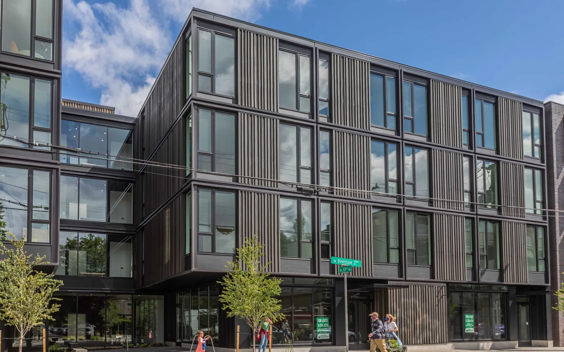 exterior front of 4 story artisan apartment building