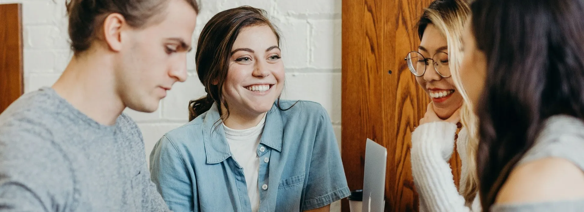 people smiling with laptop