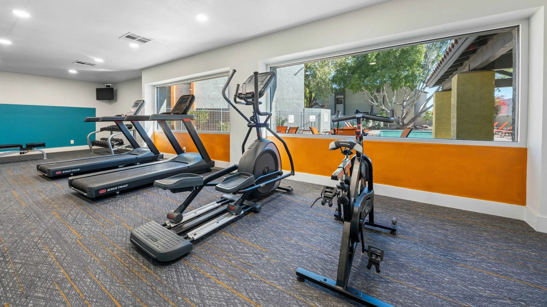 fitness center with treadmills and stationery bikes at peoria grand apartments