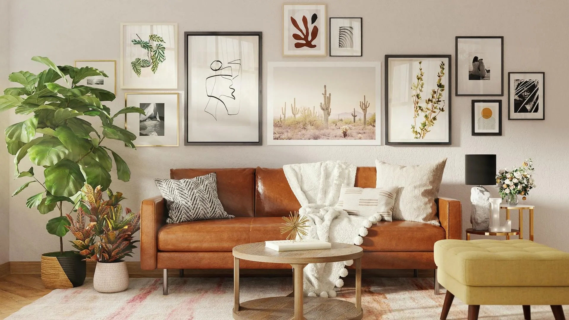 brown leather sofa with many art frames hanging behind