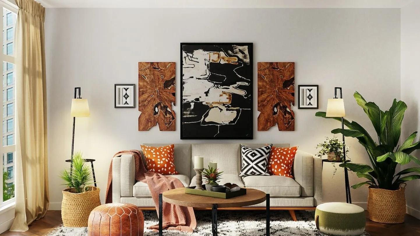 brown leather sofa with many art frames hanging behind