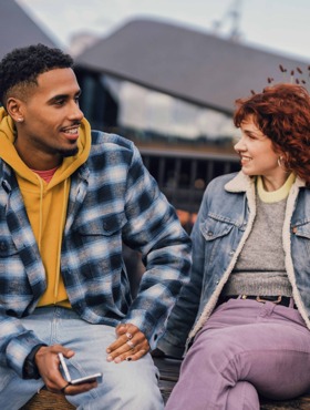 two people chatting outside