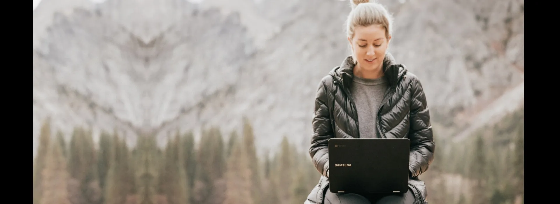 woman working on a laptop outdoors
