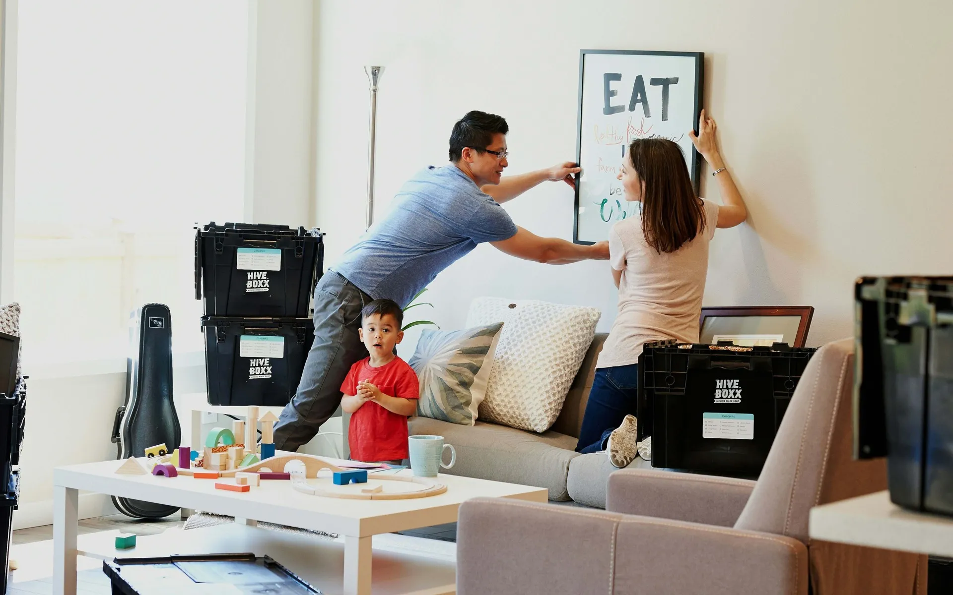 couple moving in hanging art