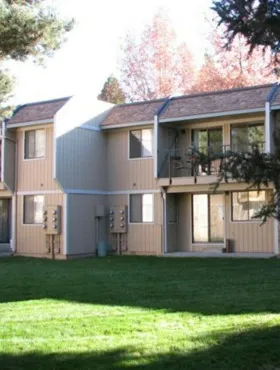 2 story apartment building and green landscaping