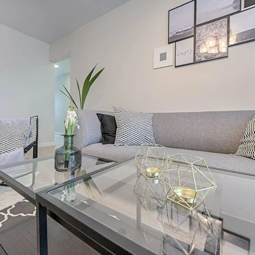 living room with taupe sofas