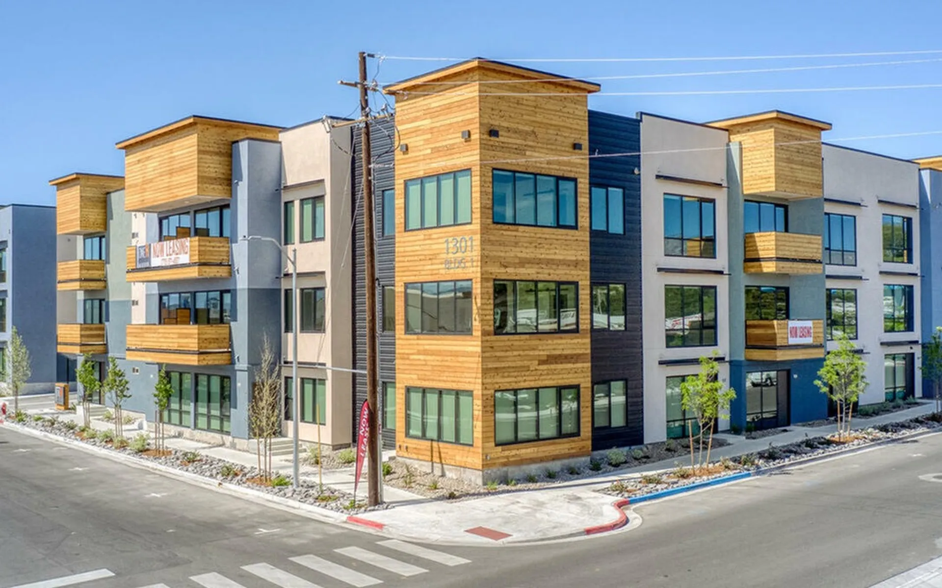 street corner and corner of 3 story apartment building at oner midtown