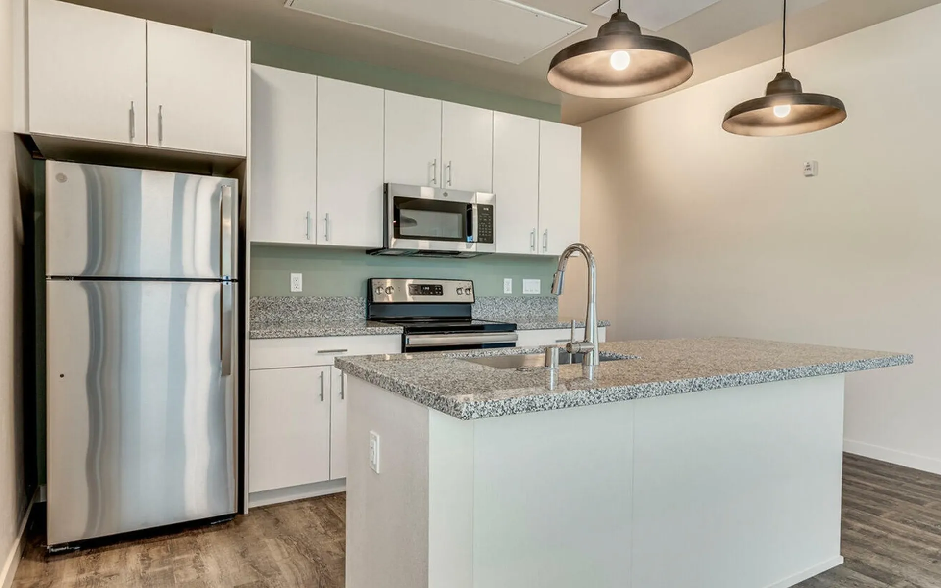 kitchen with stainless steel appliances at oner midtown
