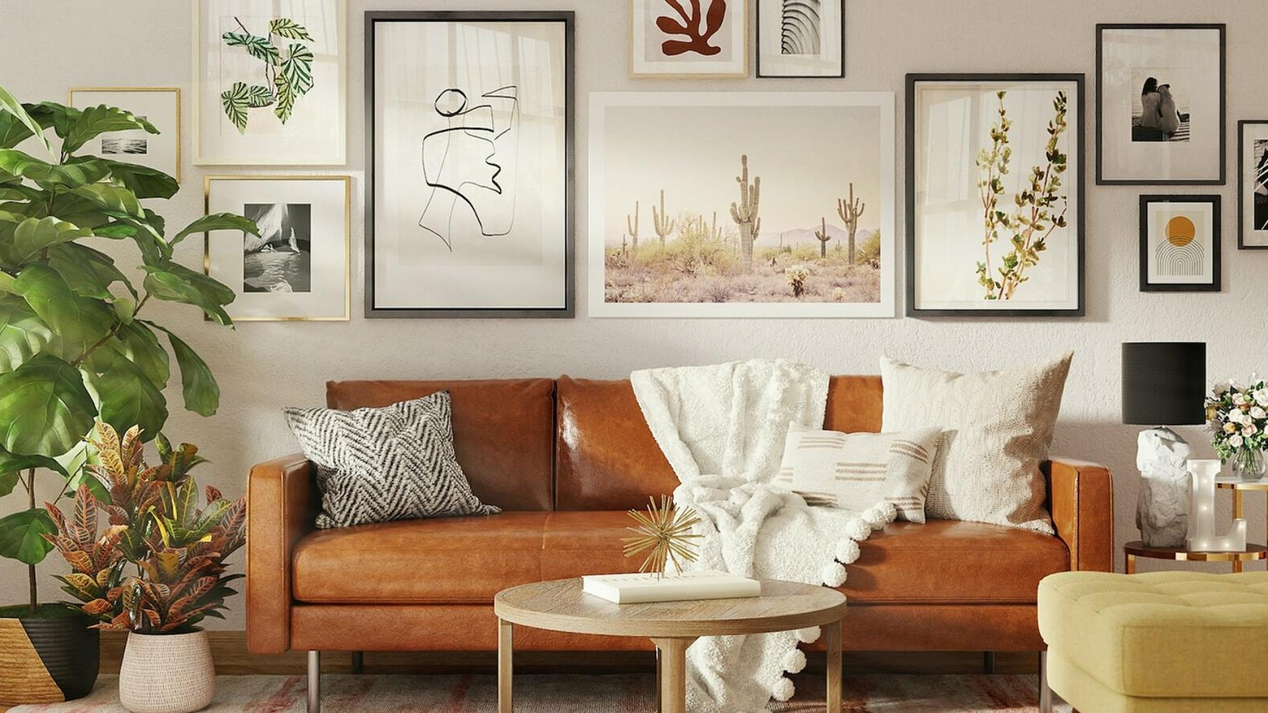 brown leather sofa and gallery wall behind