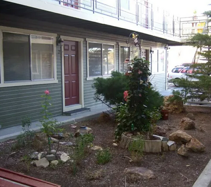 lush landscaping and entrances to linden apartments
