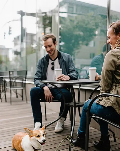 two people enjoying coffee outside