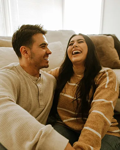 couple laughing while sitting