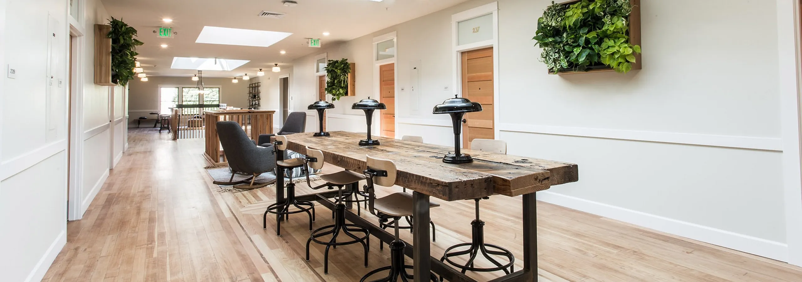 second floor lounge area with seating and work table at fairmount apartments