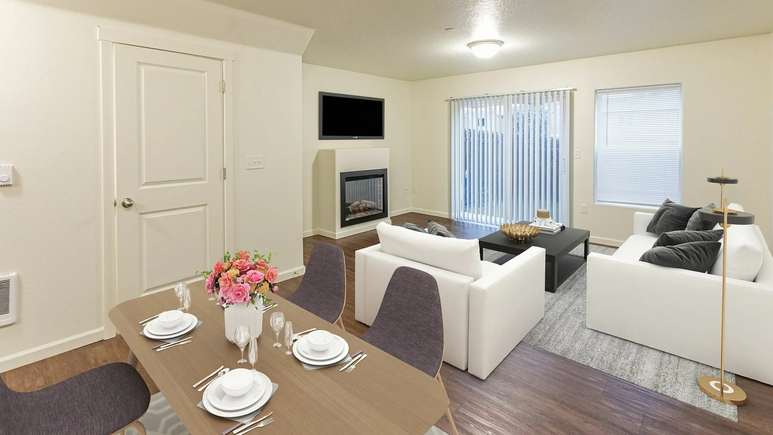 living room with white couches and black coffee table and faux wood like flooring at fairview court