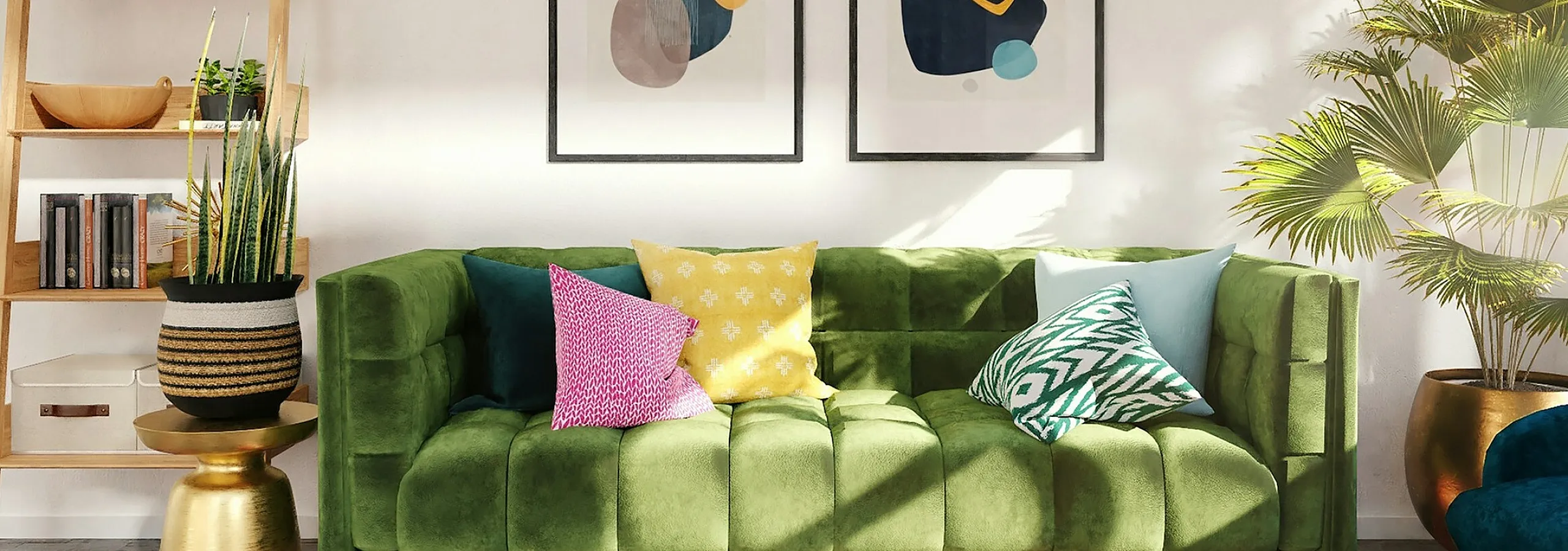 green sofa with decorative pillows and art work behind and plants at the sides