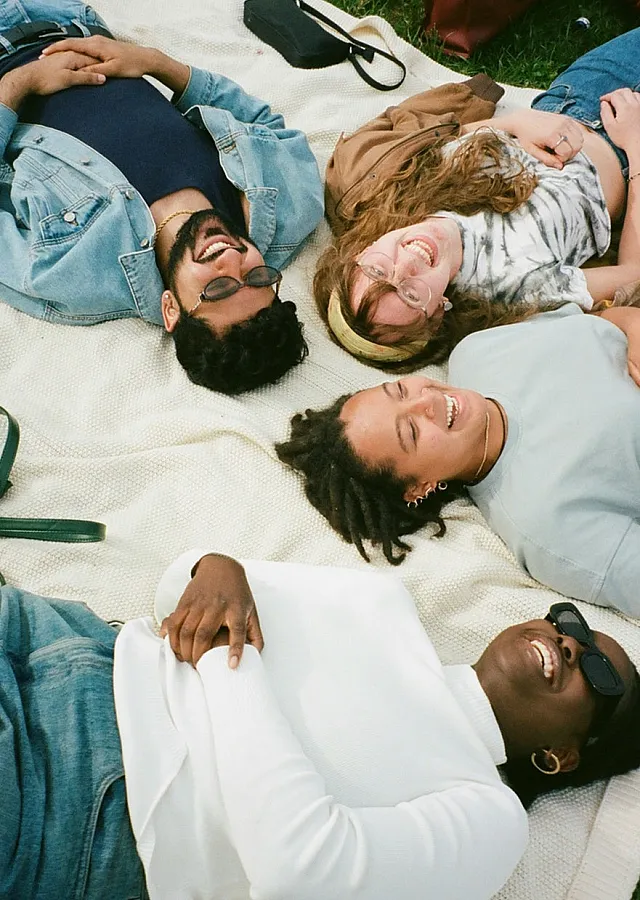 group of people looking up at the sky