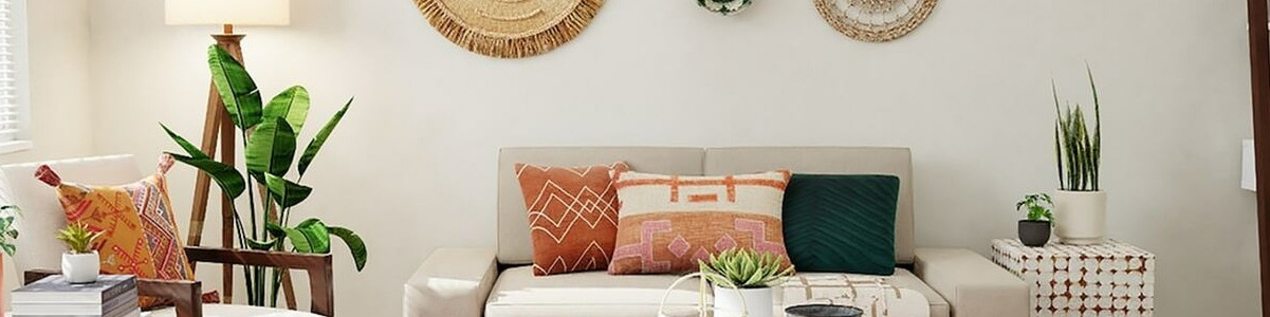 tauoe sofa with decorative pillows and artwork on the wall