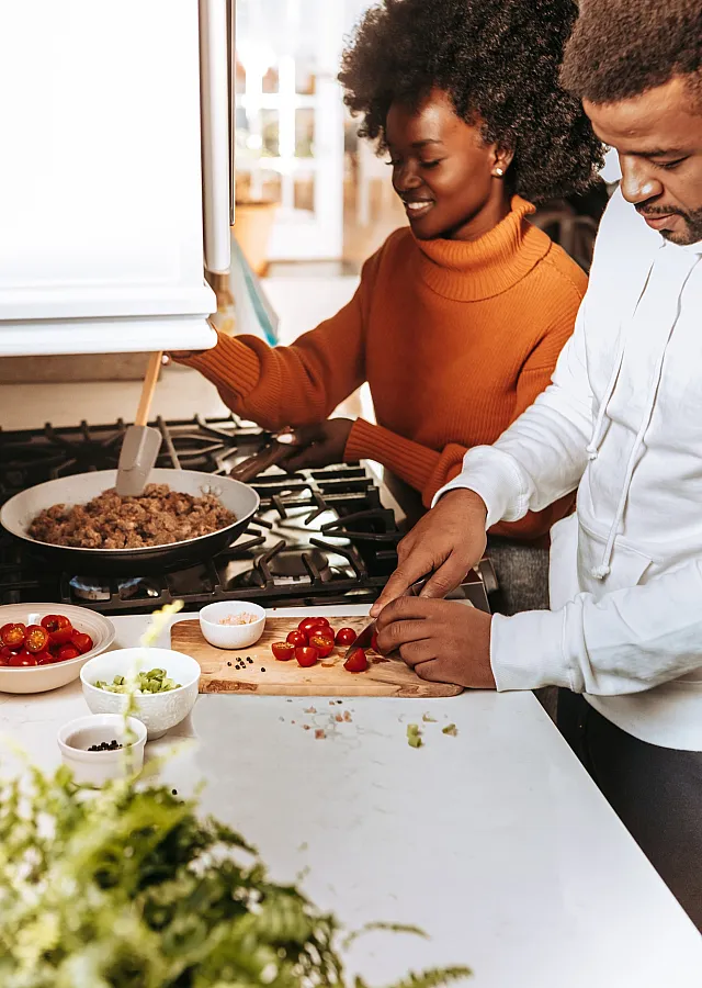 a couple cooking together