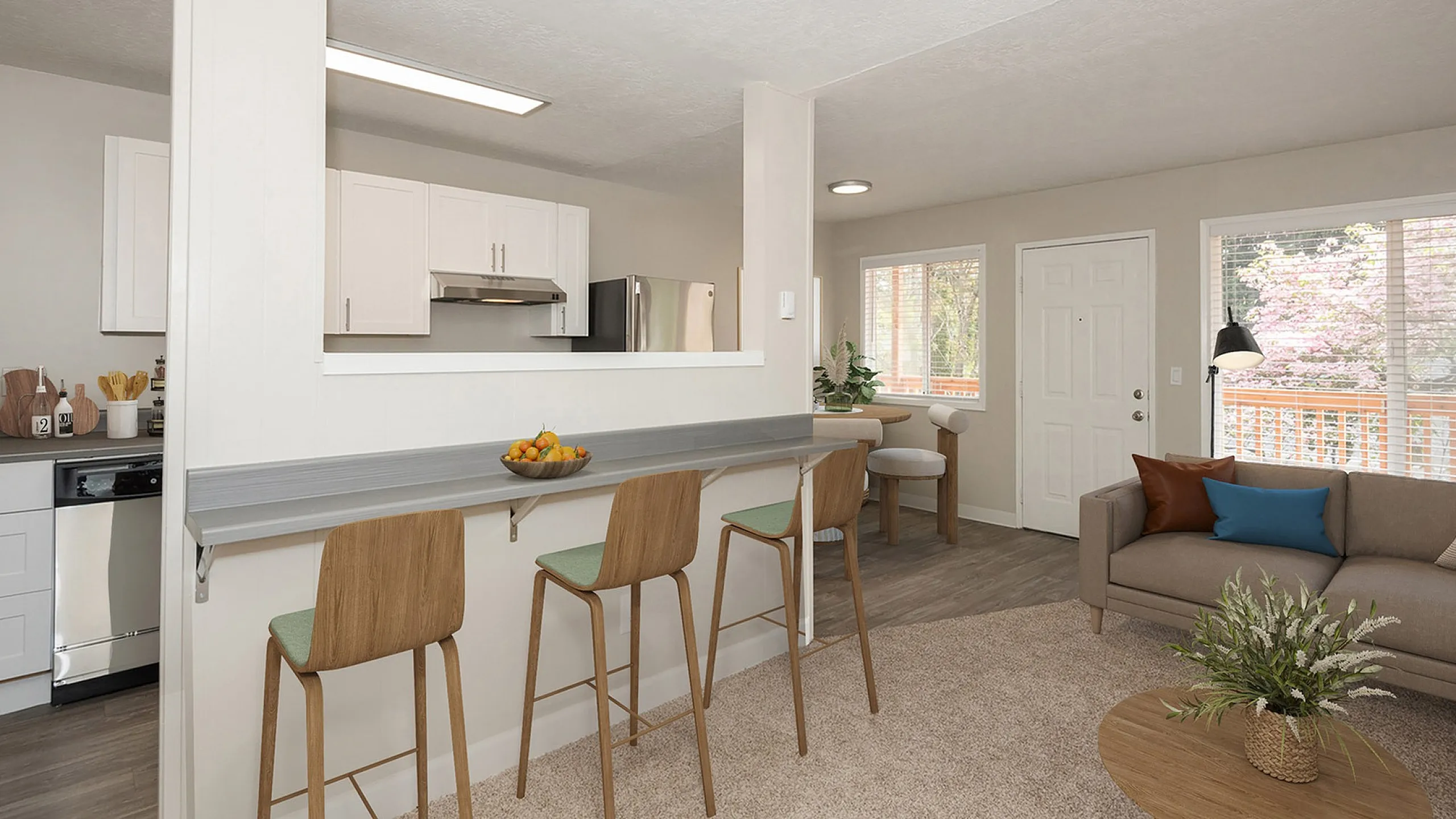 virtually staged photo of a living room and kitchen with stainless steel appliances and faux hardwood flooring at alexander vincent apartments