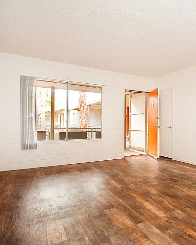 living room with faux wood flooring at solaris on university