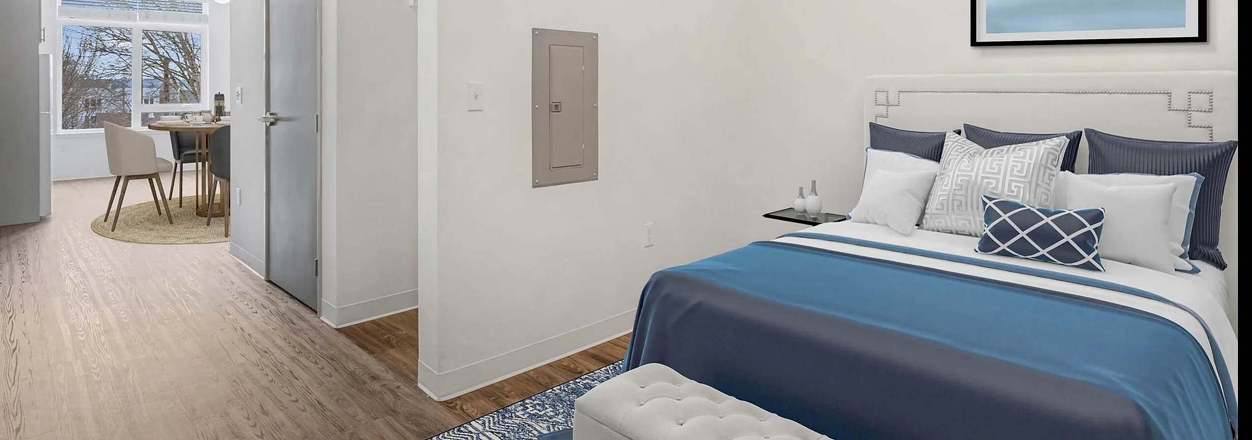 Modern bedroom with expansive windows at Koz on 13th.