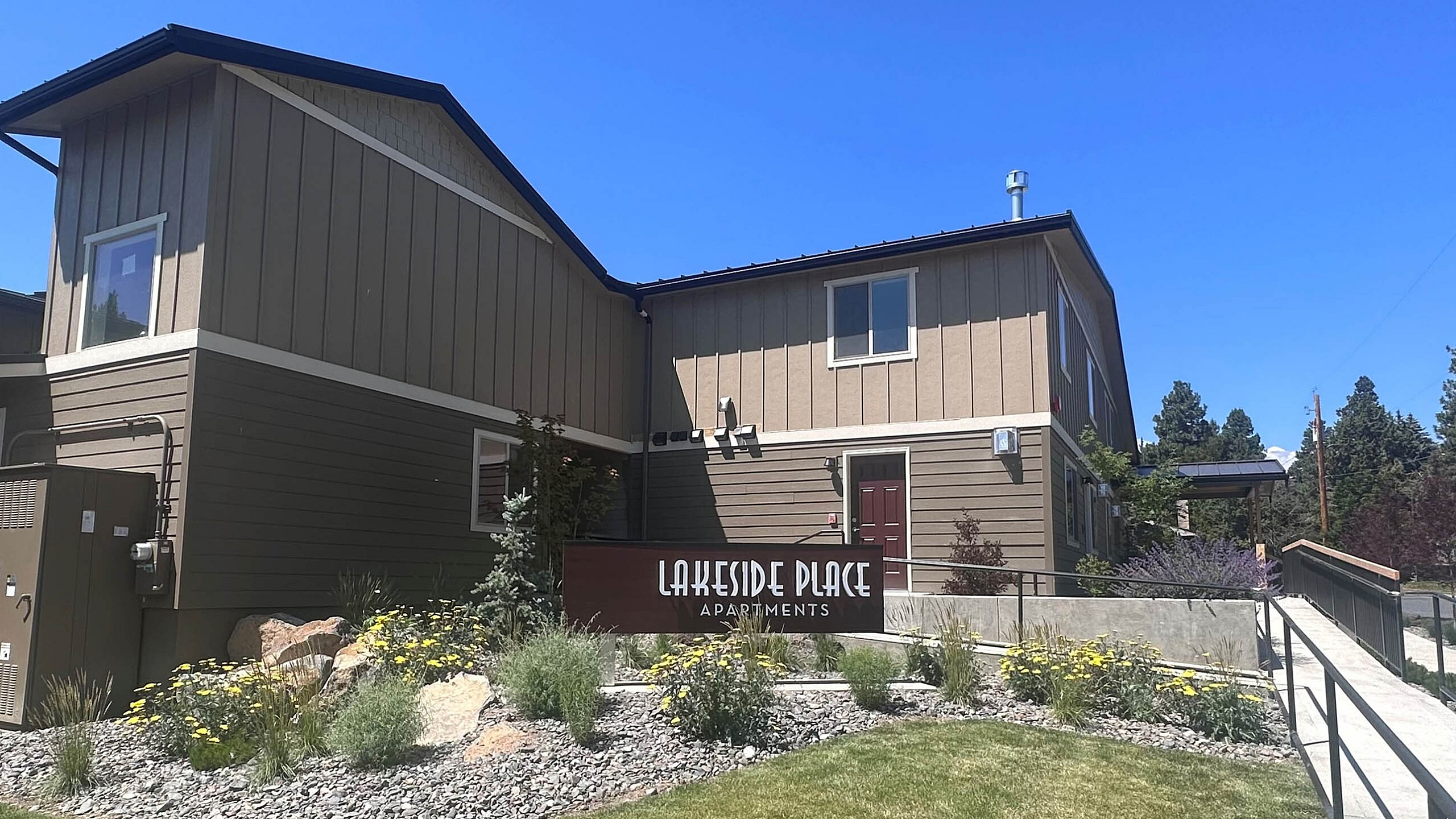 Stylish brown and tan building exterior at Lakeside Place apartments.