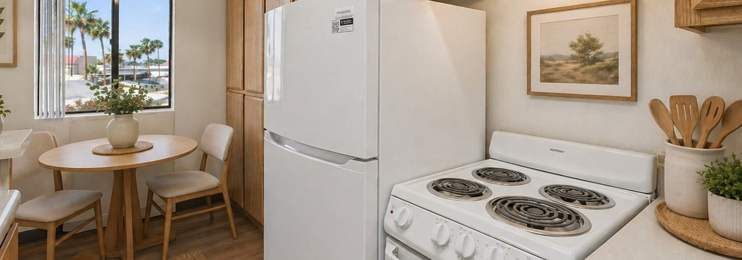 kitchen with white appliances and wood like flooring at orchard mesa