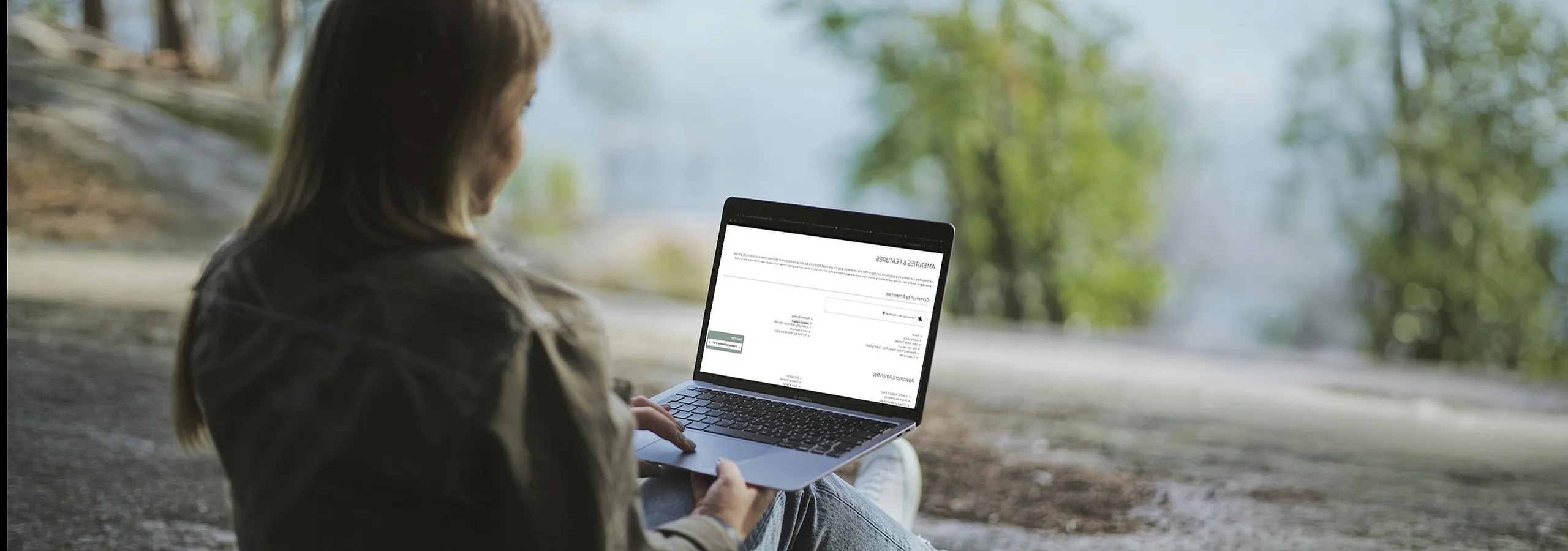 woman-outdoors-sitting-with-laptop