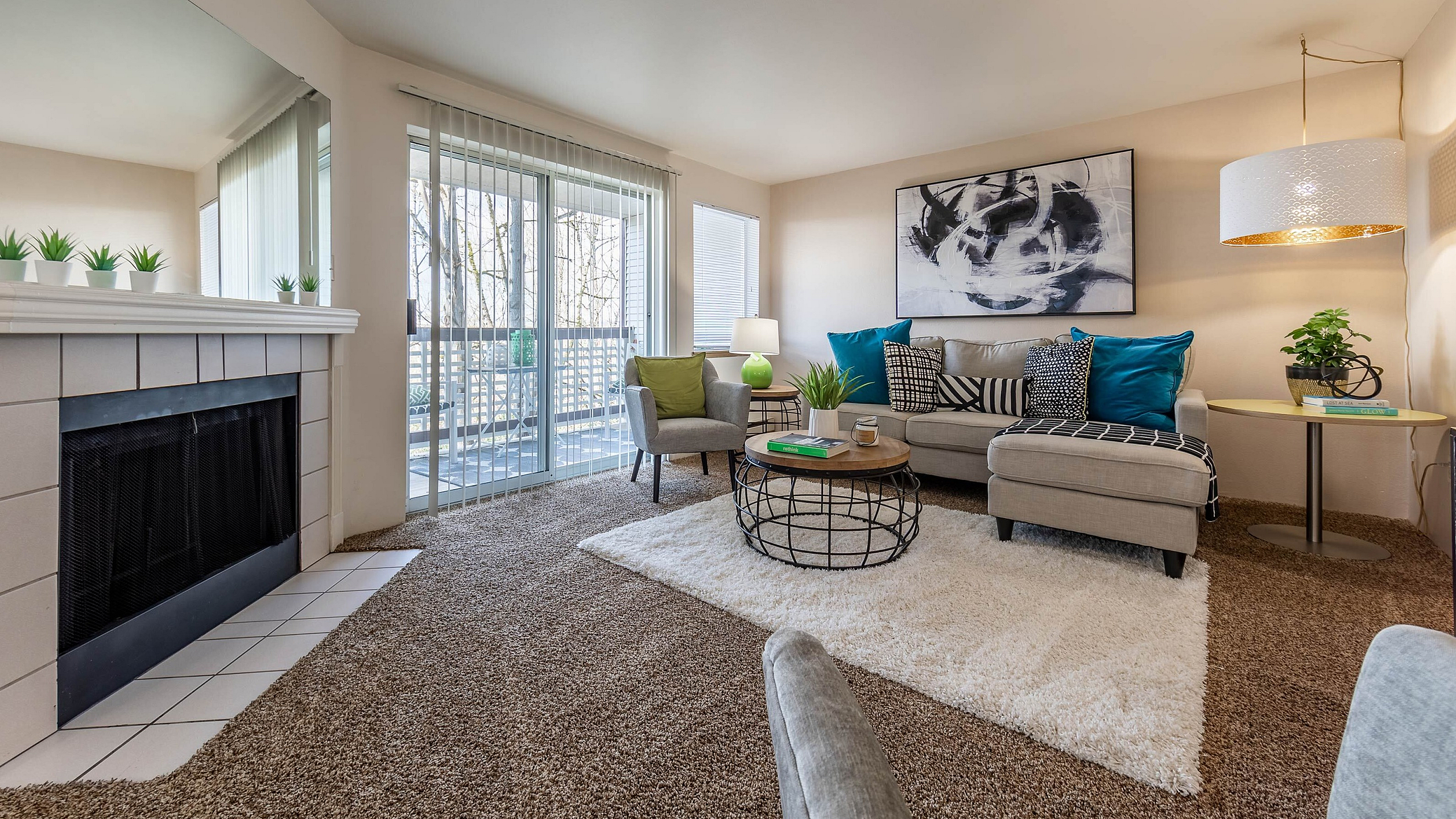 Spacious living area with plush carpets and modern furniture at Berkeley Heights Apartment Homes.