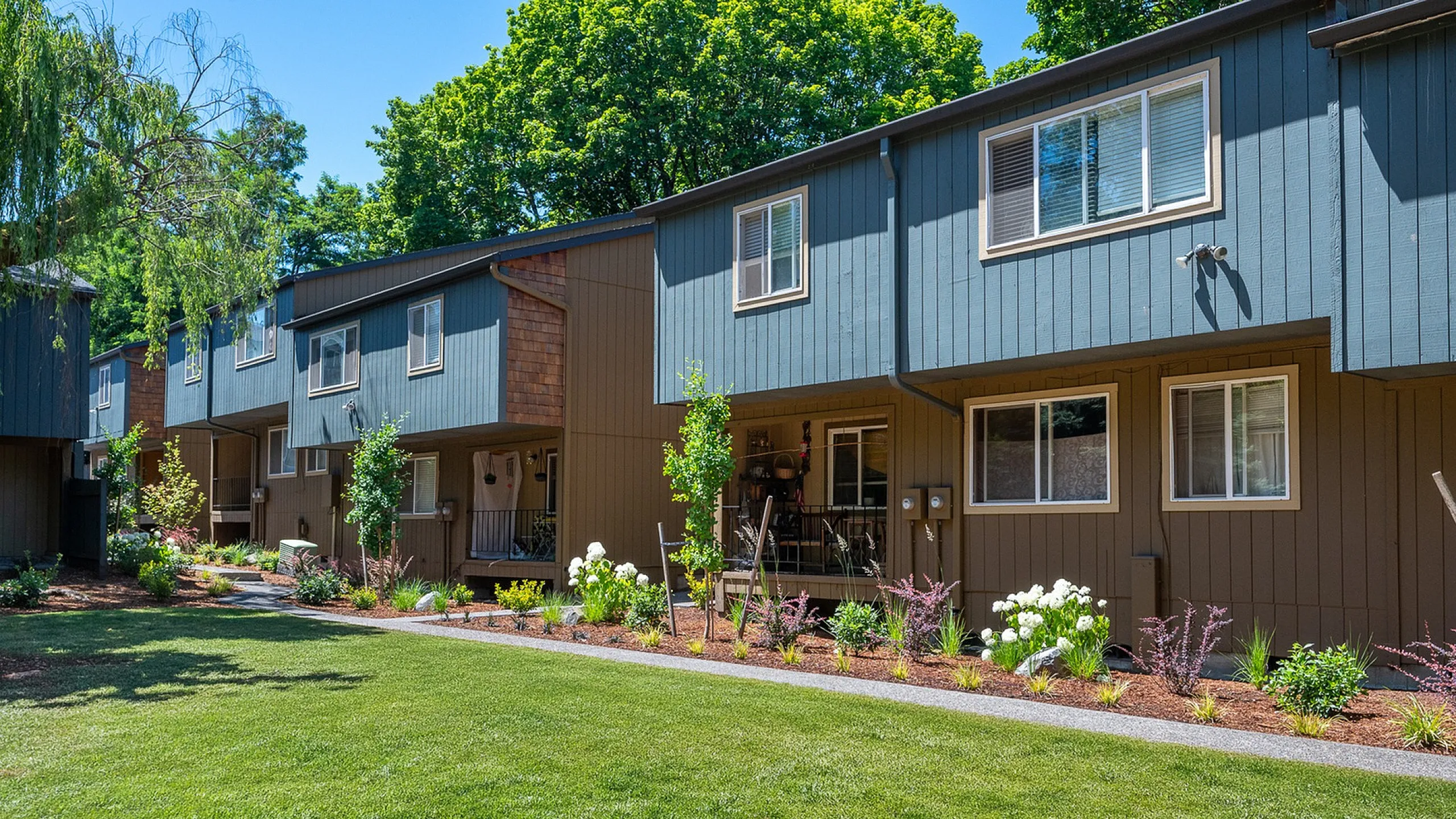 exterior of creston villa with grass and landscaping