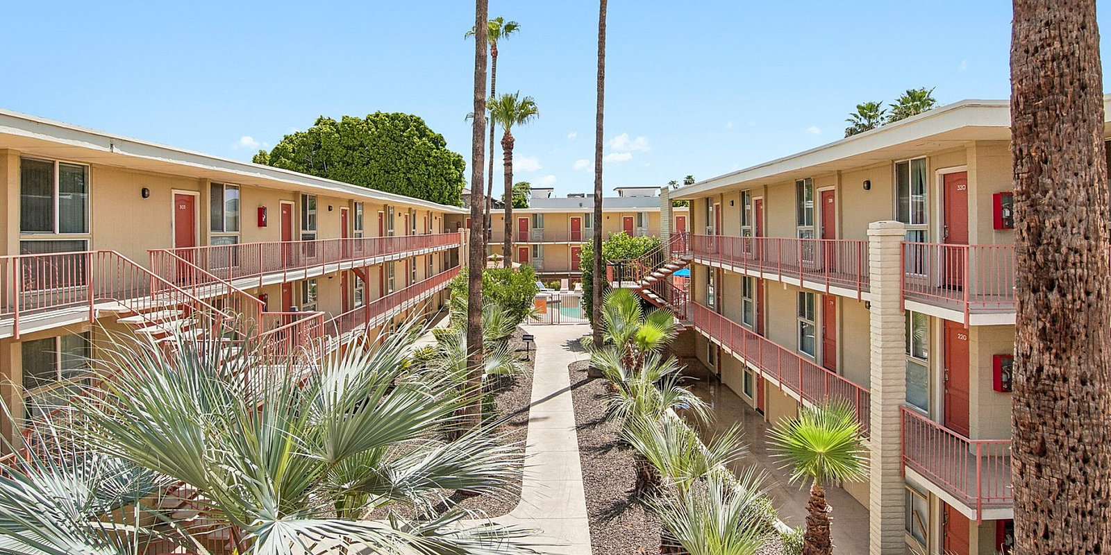 Courtyard at Solaris at the biltmore with palm trees and garden style entry