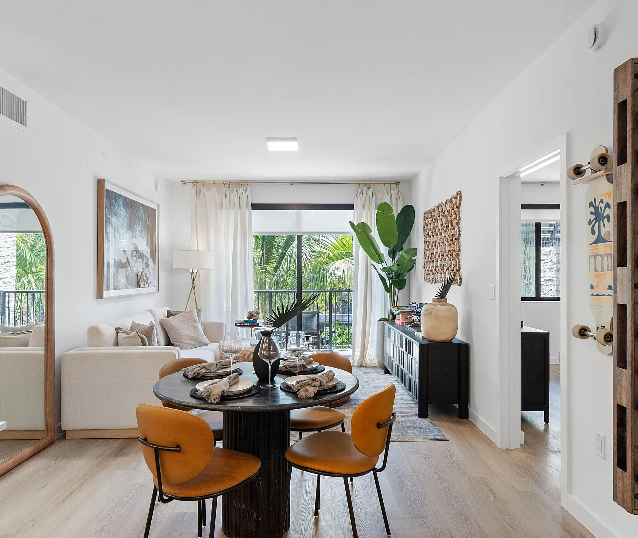 Living room and dining area in a Caroline Pompano Beach apartment home