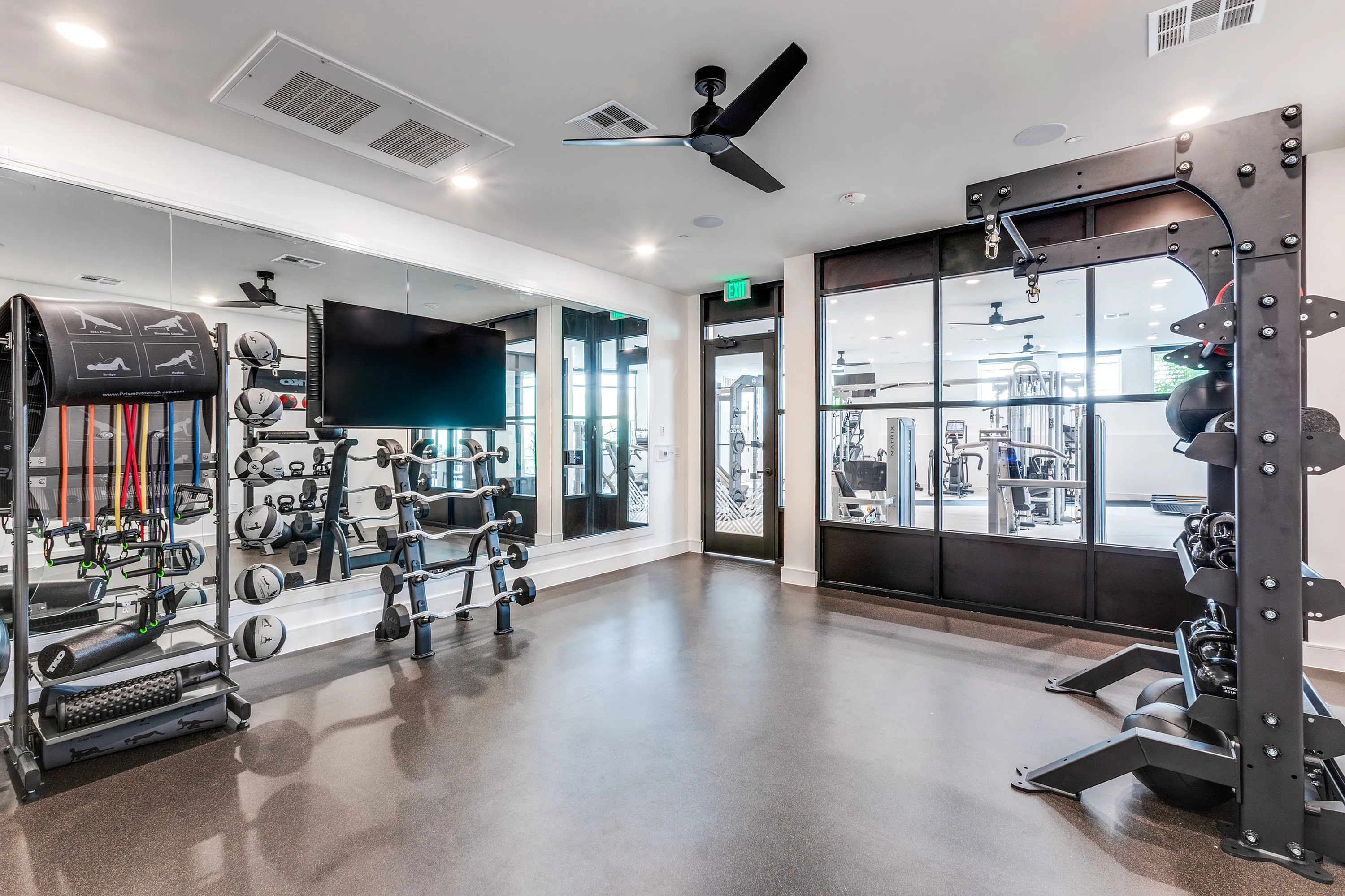 Modern fitness center with state-of-the-art equipment, sleek design, and ample space for personalized workouts.